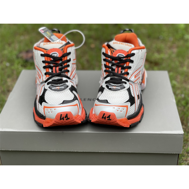 kith x Ba*len*cia*ga runner sneaker white/orange/black