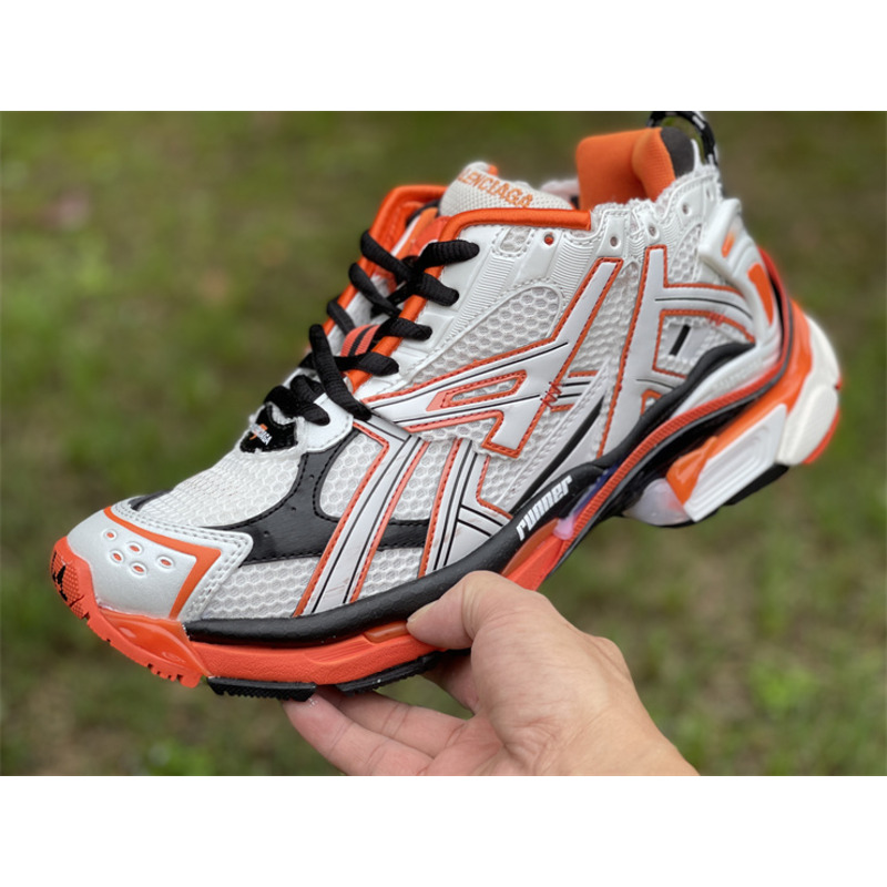 kith x Ba*len*cia*ga runner sneaker white/orange/black