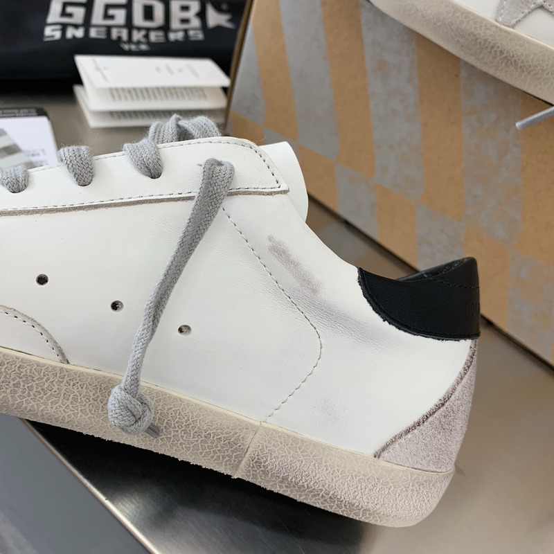 golden goose men’s S*per-star sneakers with suede star and black heel tab