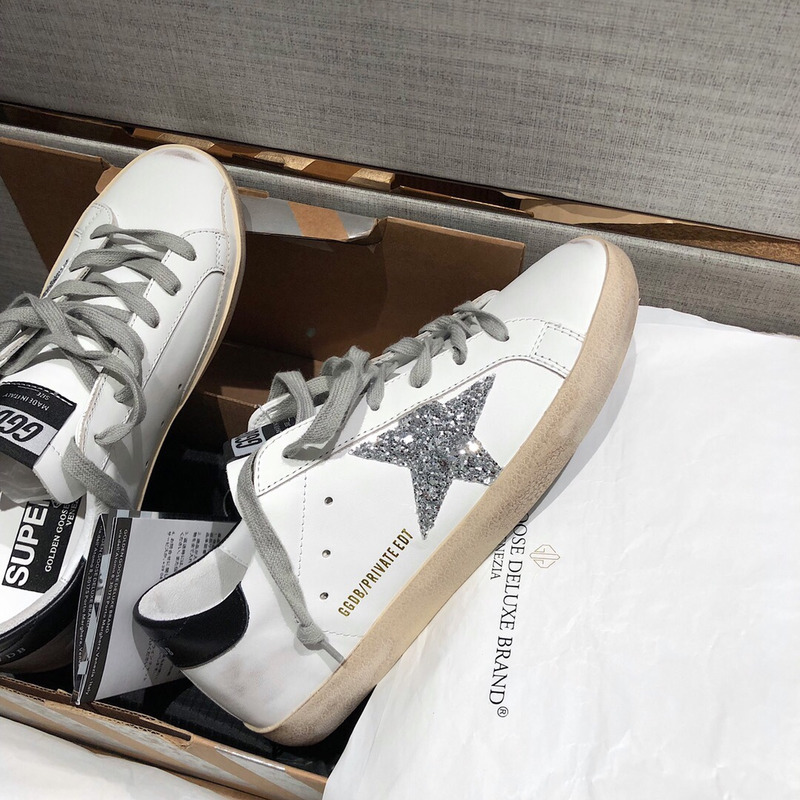golden goose men’s S*per-star sneakers with silver star and black heel tab