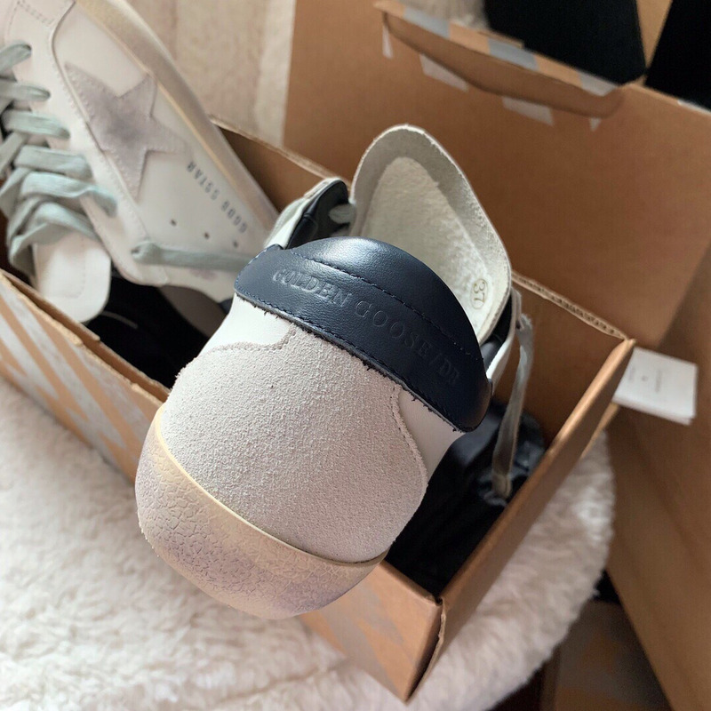 golden goose men’s S*per-star sneakers with suede star and blue heel tab