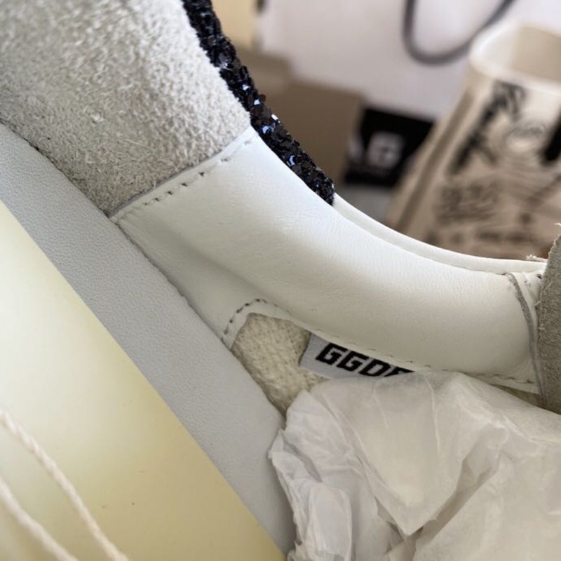 golden goose S*per-star sneakers with purple star logo and black heel tab