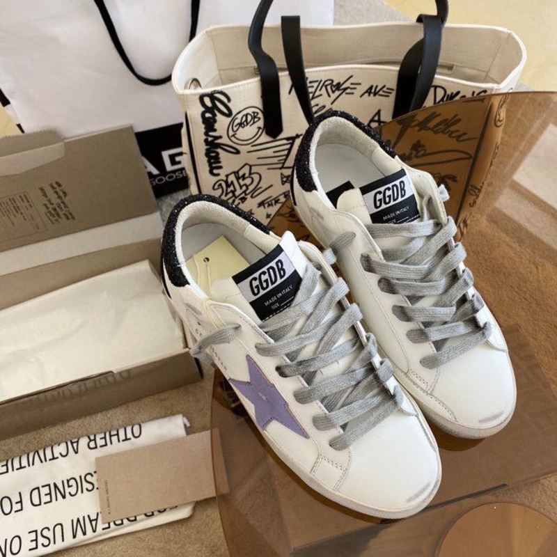 golden goose S*per-star sneakers with purple star logo and black heel tab