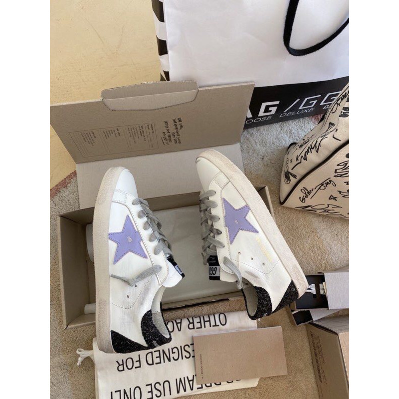 golden goose S*per-star sneakers with purple star logo and black heel tab