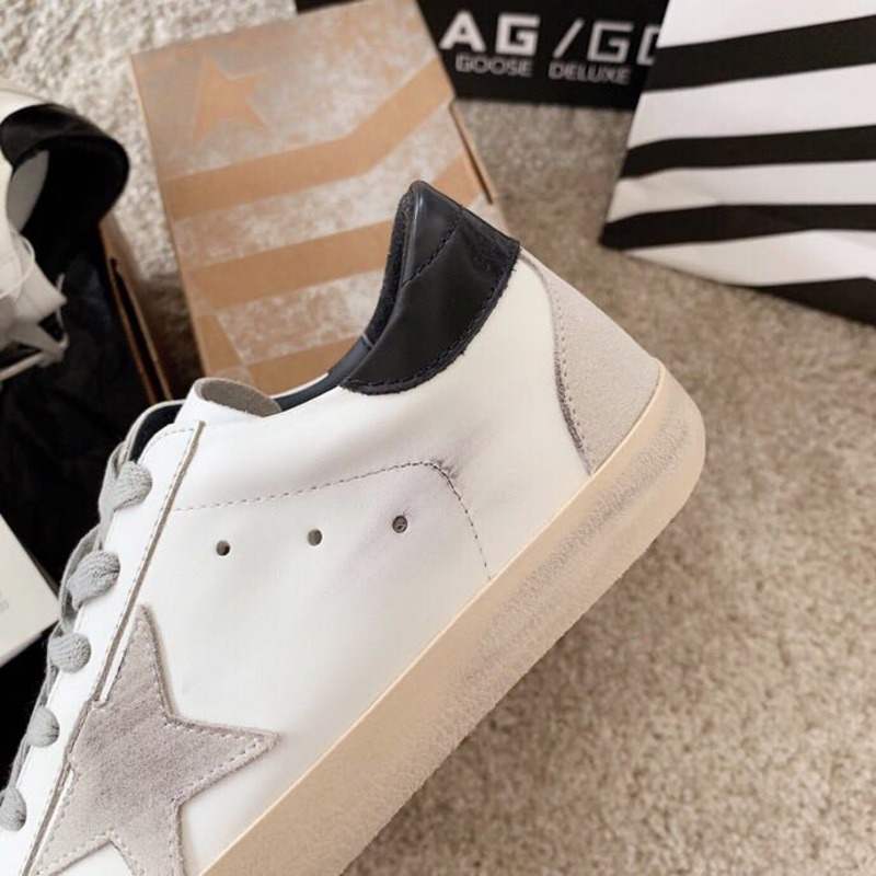 golden goose men’s S*per-star sneakers with suede star and black heel tab