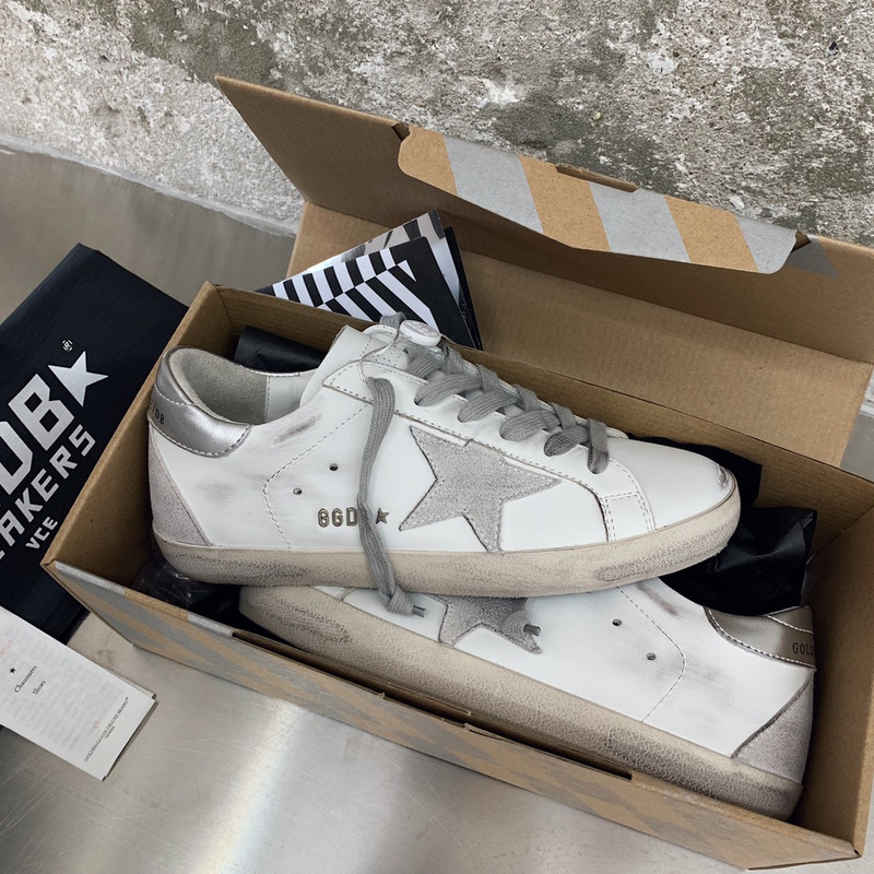 golden goose men’s S*per-star sneakers with suede star and sliver heel tab