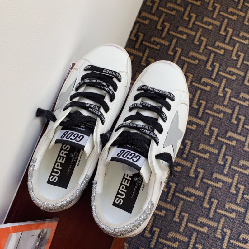 golden goose men’s S*per-star sneakers with suede star and sliver glitterheel tab