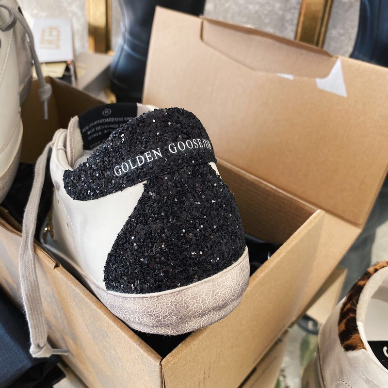 golden goose men’s S*per-star sneakers with golden glitter and black heel tab