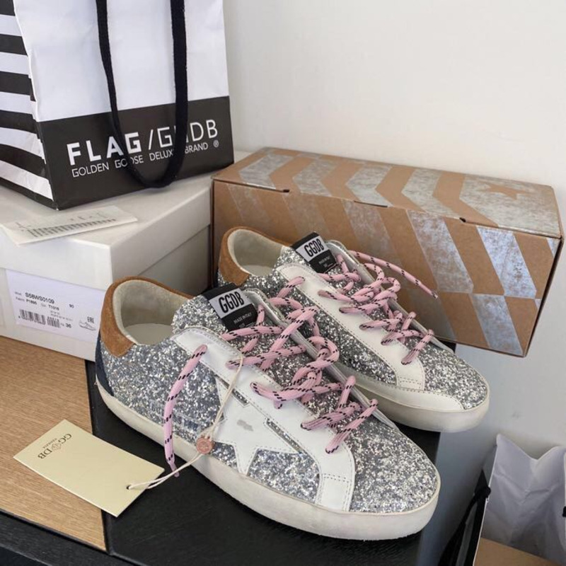 golden goose men’s S*per-star sneakers with sliver glitter and brown heel tab