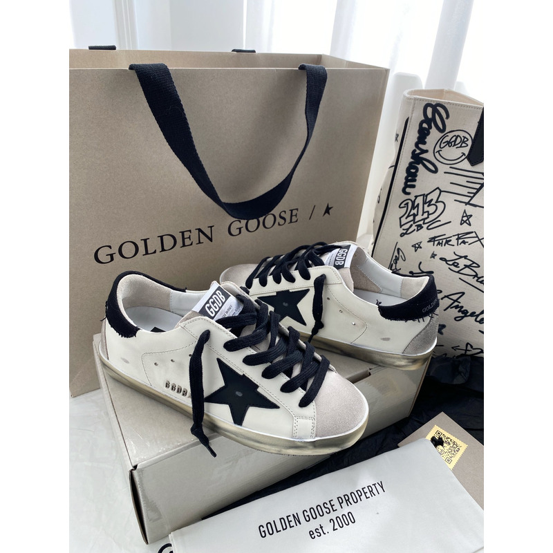golden goose men’s S*per-star sneakers with black suede star and black heel tab