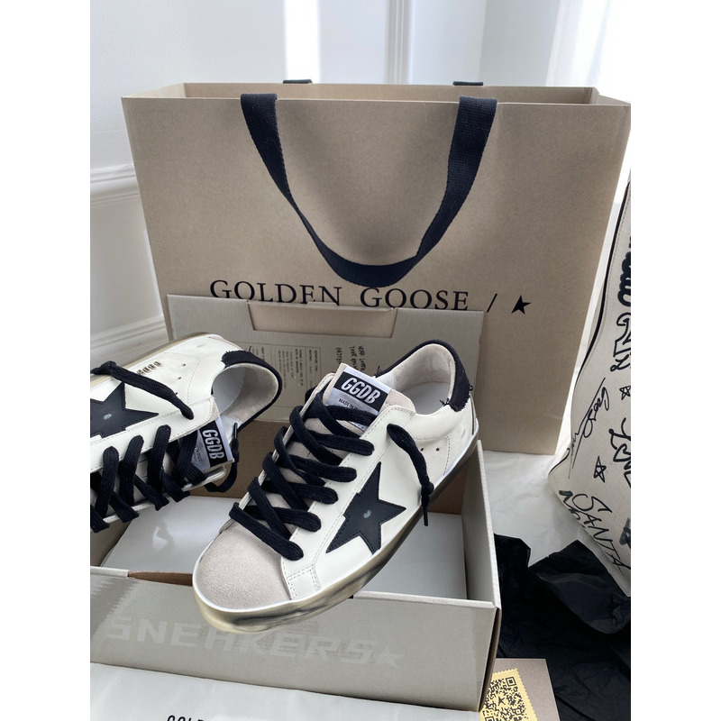 golden goose men’s S*per-star sneakers with black suede star and black heel tab