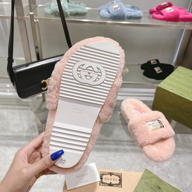 g*u*i x the n0*h F**e shearling slides light pink