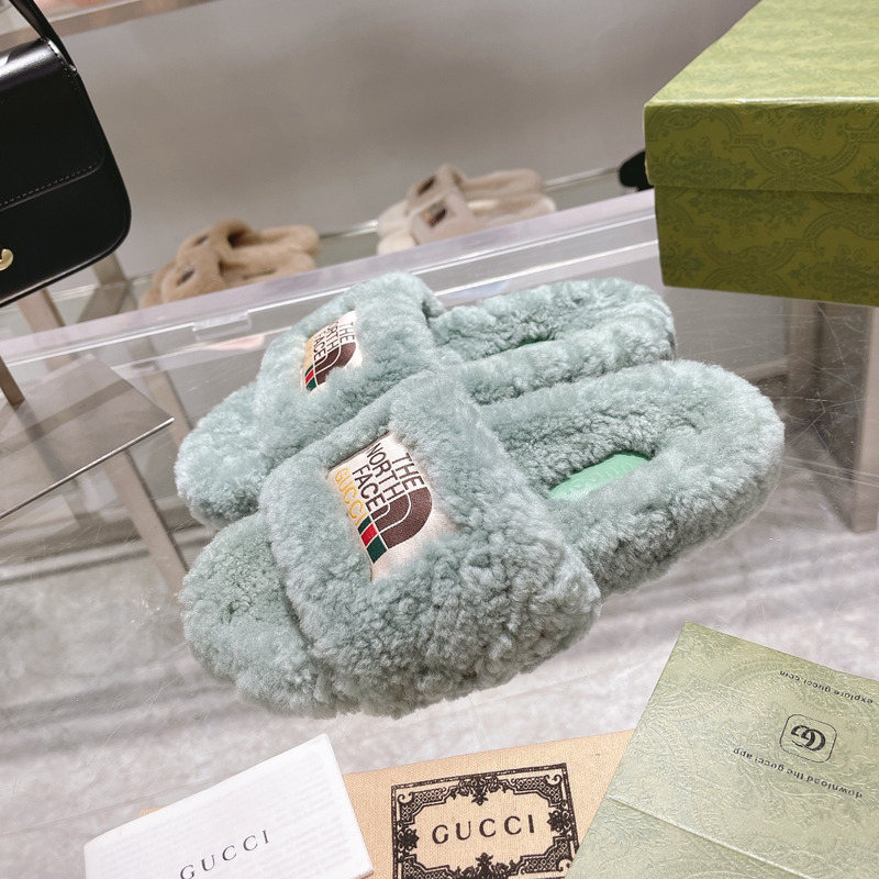 g*u*i x the n0*h F**e shearling slides green