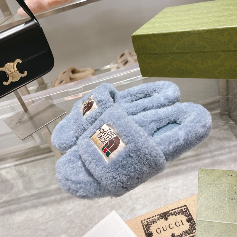 g*u*i x the n0*h F**e shearling slides blue