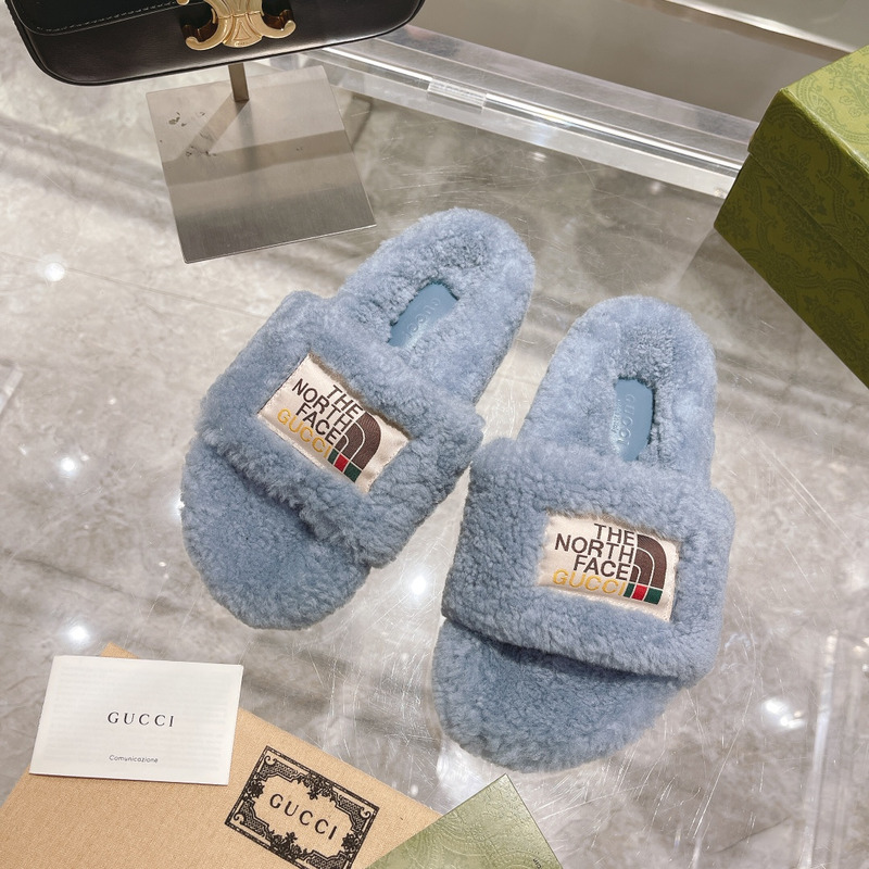 g*u*i x the n0*h F**e shearling slides blue