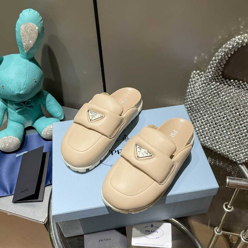Pra*a women\''s beige triangle logo plaque slip-on sandals