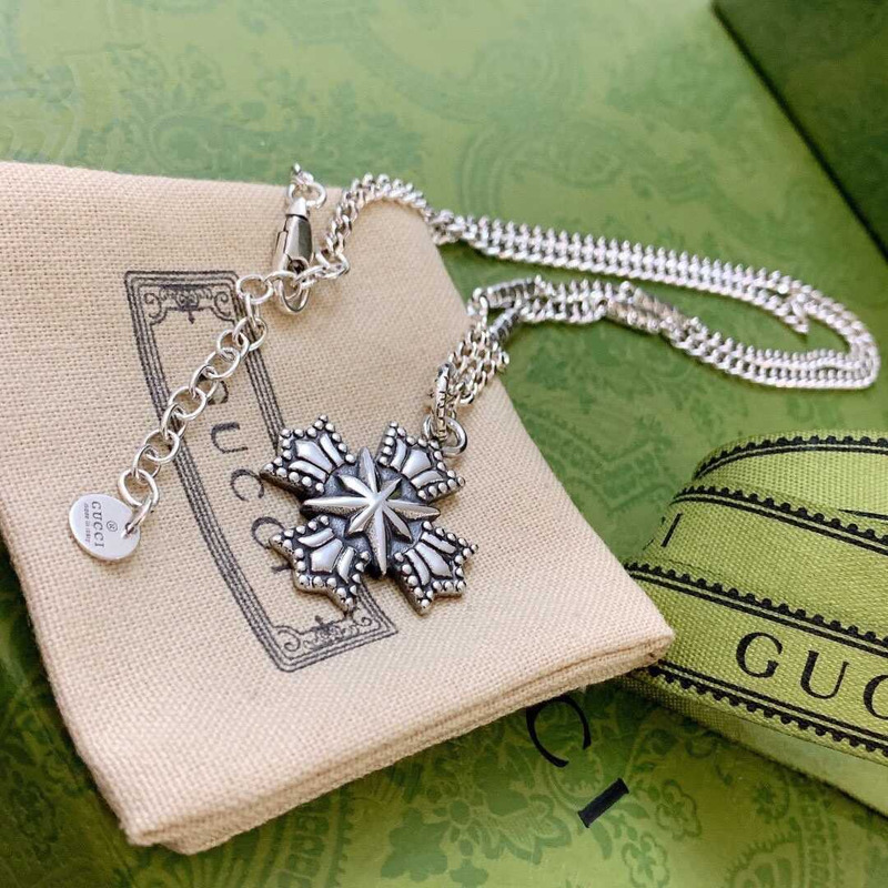 G*u*i crucifixion necklace