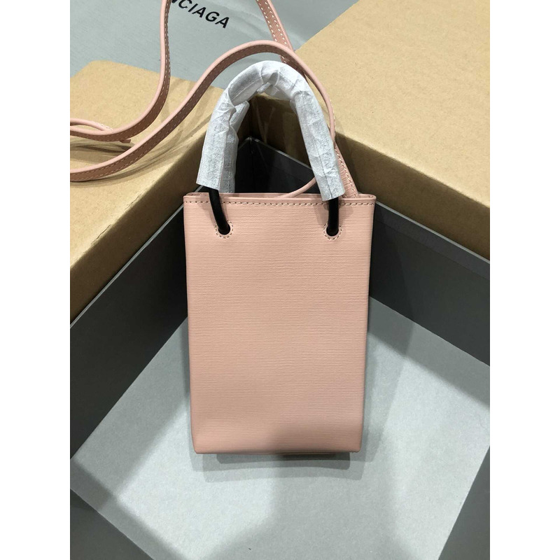 Ba*len*cia*ga textured calfskin logo shopping phone holder bag nude pink