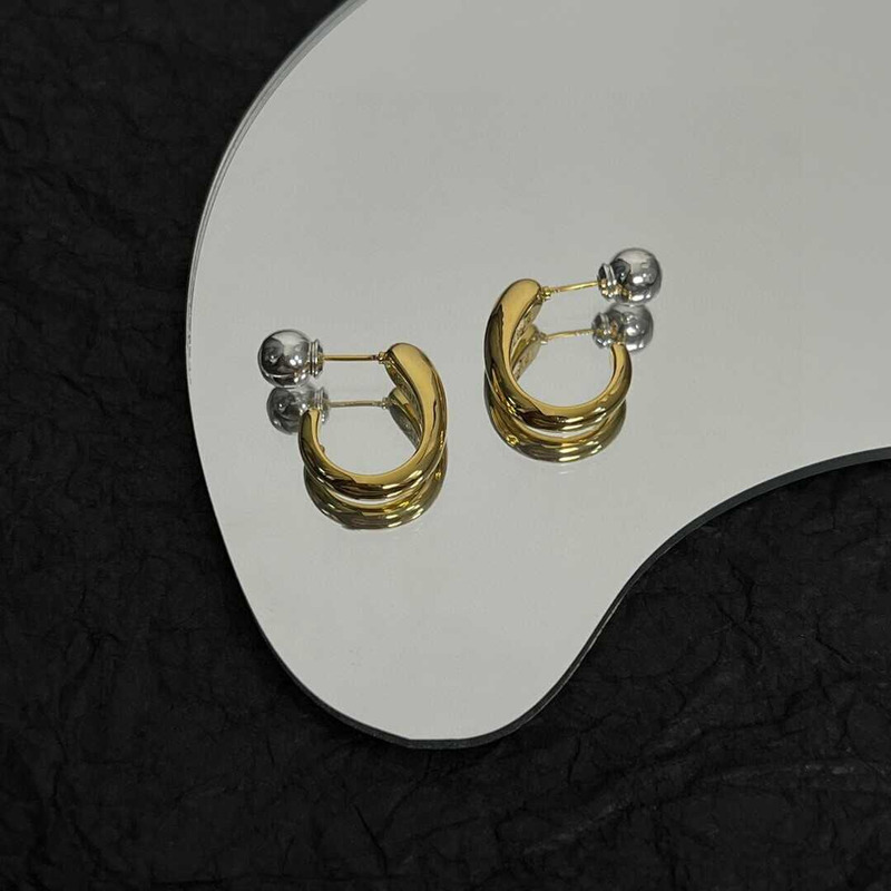 Ce**e earrings in brass gold
