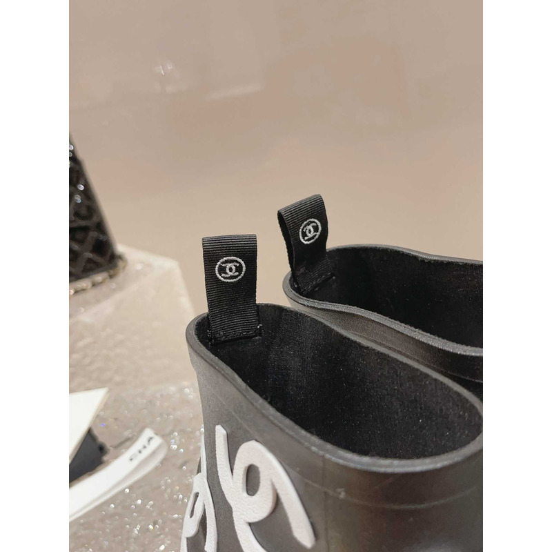 Ch*el short rain boots black and white