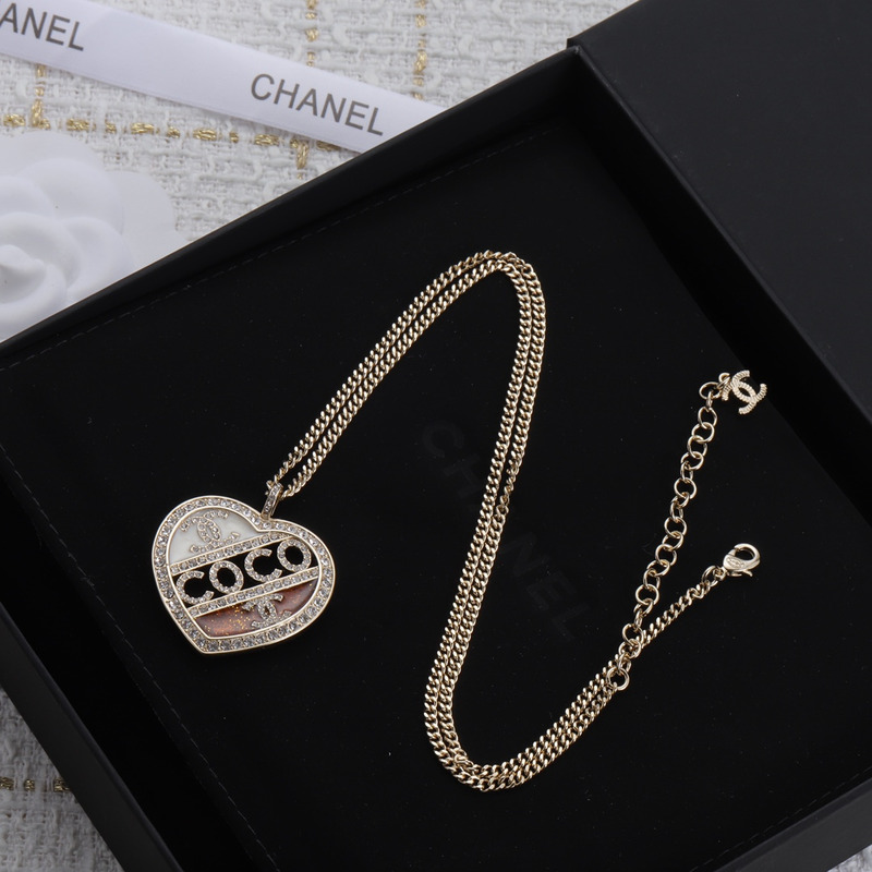 Ch*el pendant metal and crystal necklace