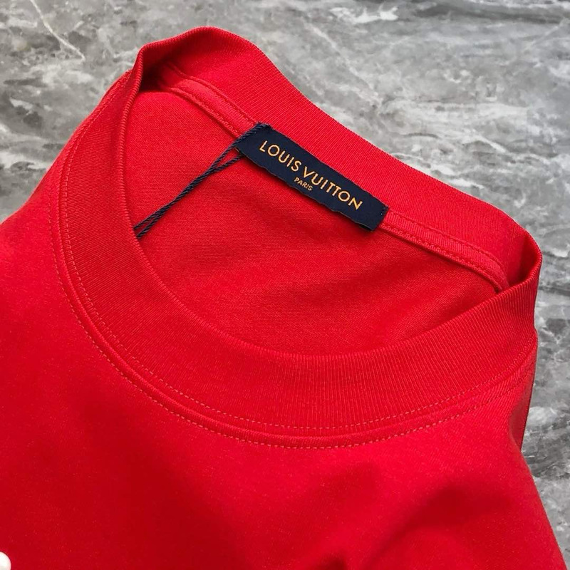 l**is V*t*n t-shirt red calligraphy and a violin case