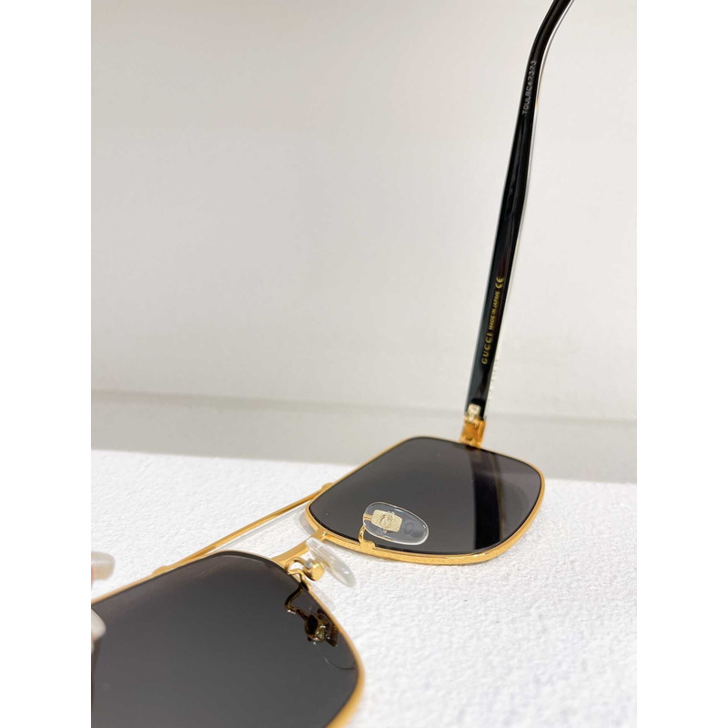 G*u*i sunglasses gold