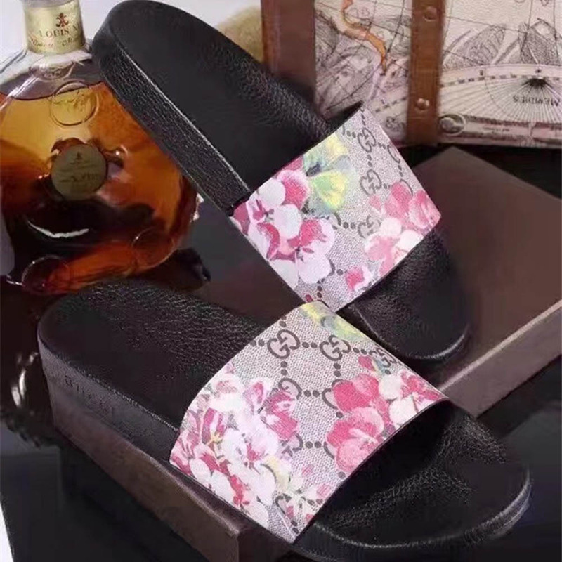 G*u*i bird and flower flip flops
